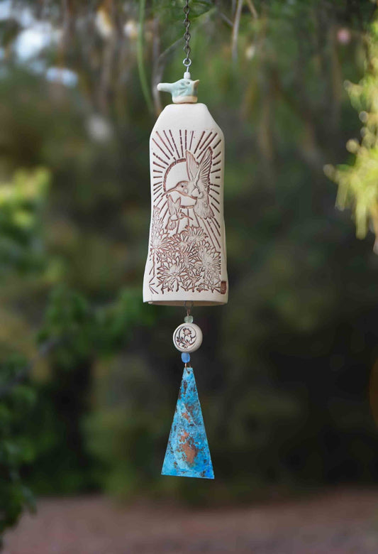 Green glazed hummingbird wind chime on rustic tan ceramic bell with copper sail