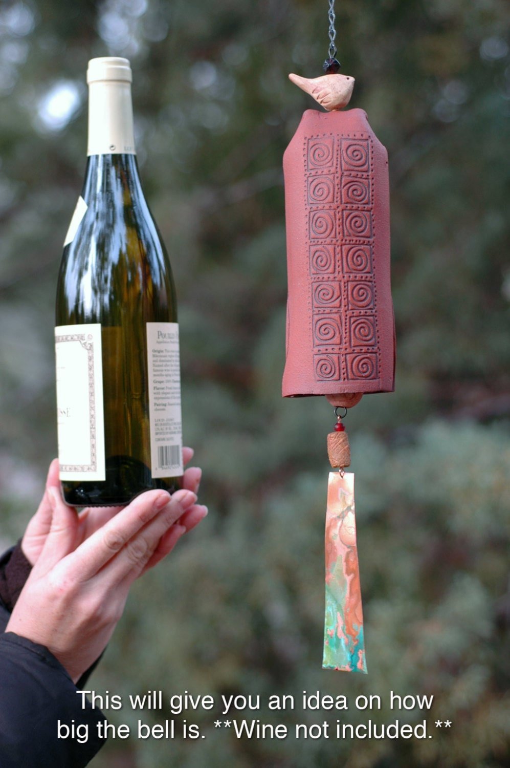 Ceramic Wind Chime size compared to a wine bottle.