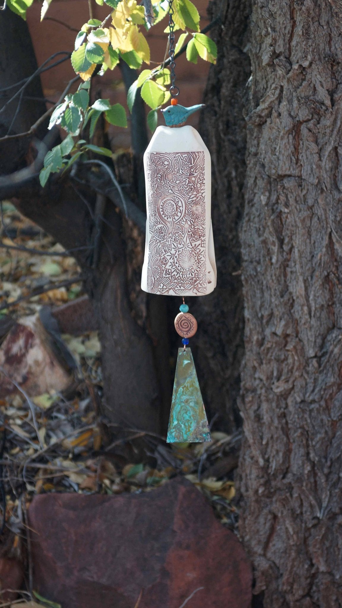 Outdoor ceramic wind chime hanging on porch, gift for garden lovers