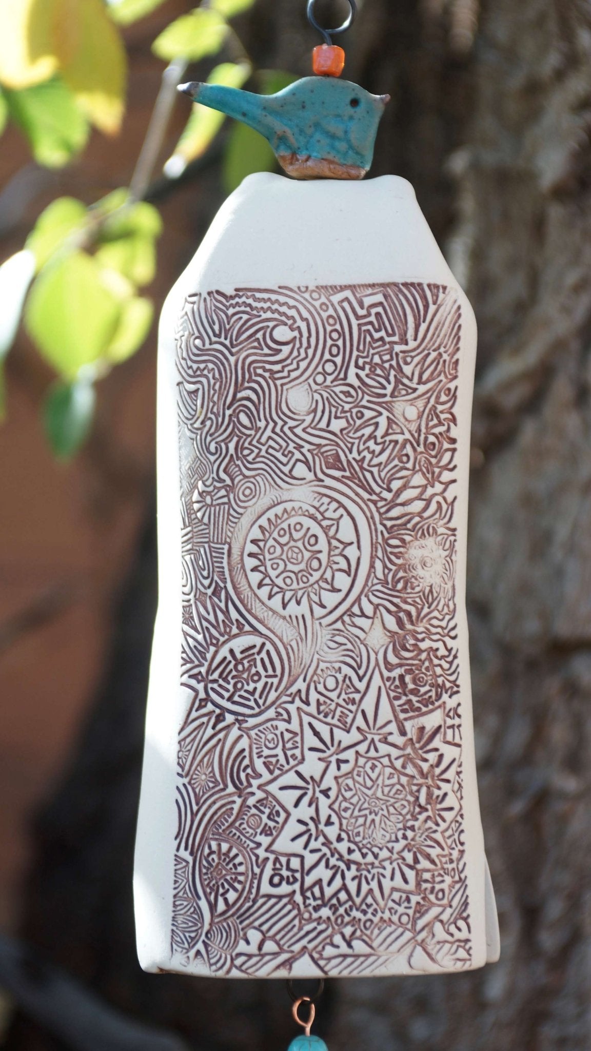 White Starburst ceramic wind chime with blue bird, custom engraved sail