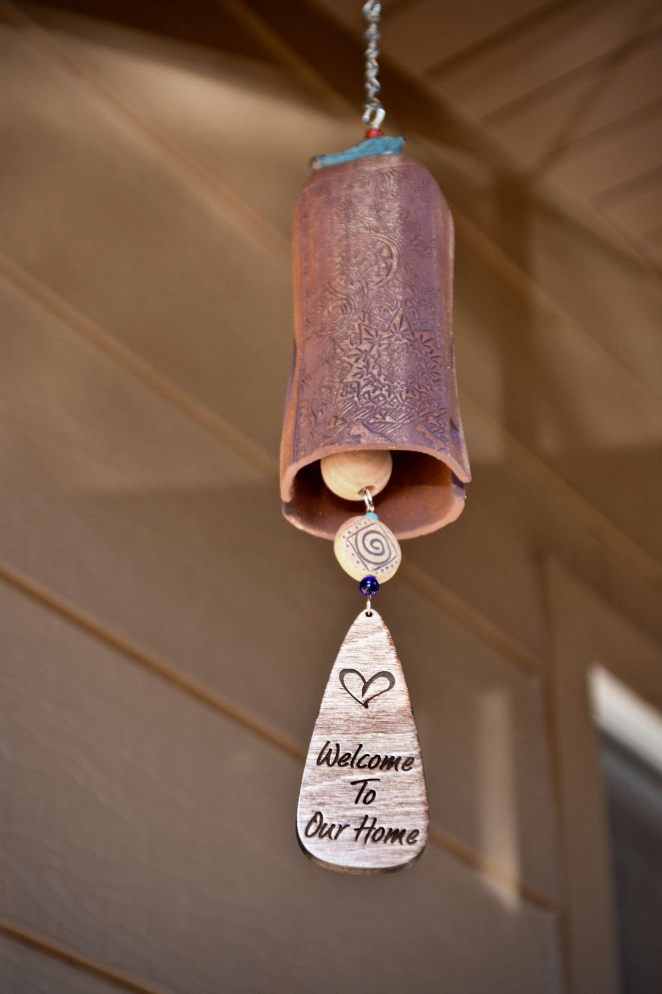 Mixed clay ceramic wind chime with blue glazed bird and engraved wind sail