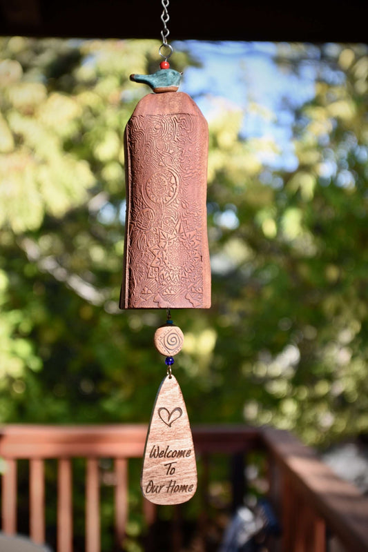 Mixed clay ceramic wind chime with blue glazed bird and engraved wind sail