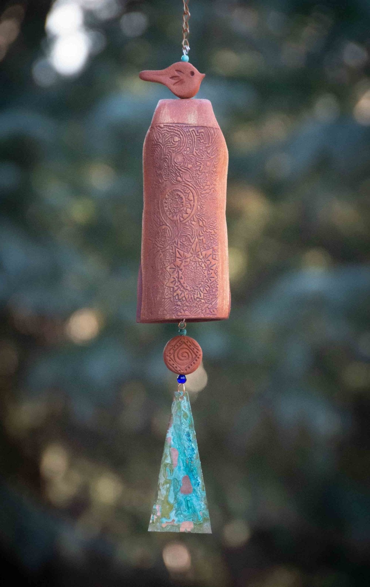 Rustic red bird bereavement wind chime with rustic red bead and white clay bell – handmade sympathy gift for outdoor display.