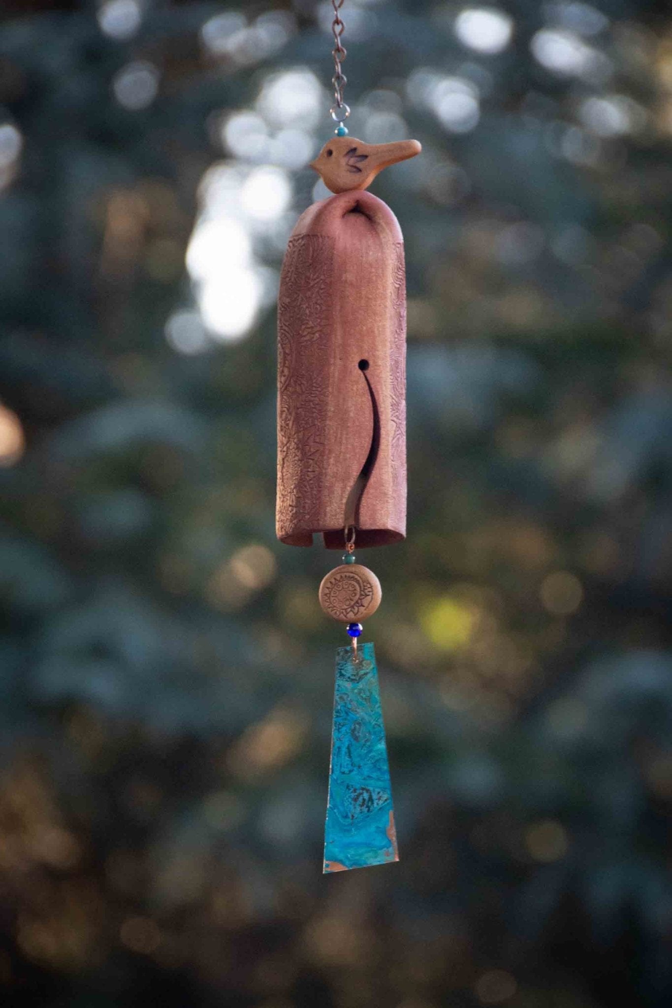 Rustic red bird bereavement wind chime with rustic tan bead and white clay bell – handmade sympathy gift for outdoor display.