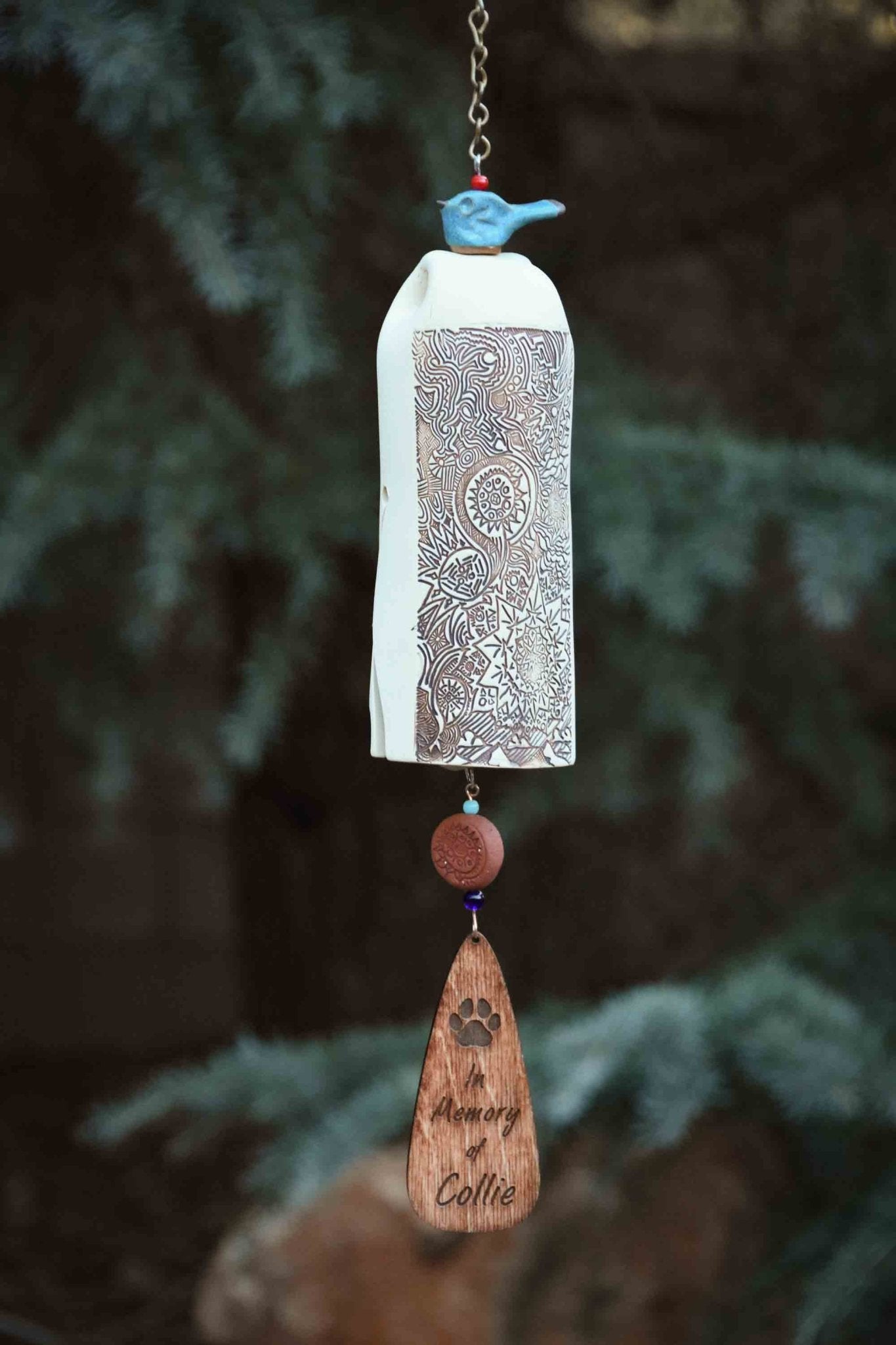Custom sympathy wind chime with rustic red bird topper and white bell body