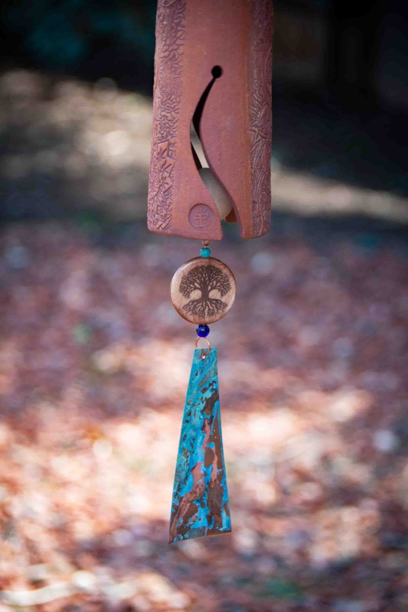 Comforting memorial gift wind chime with tan bird and patinaed copper sail