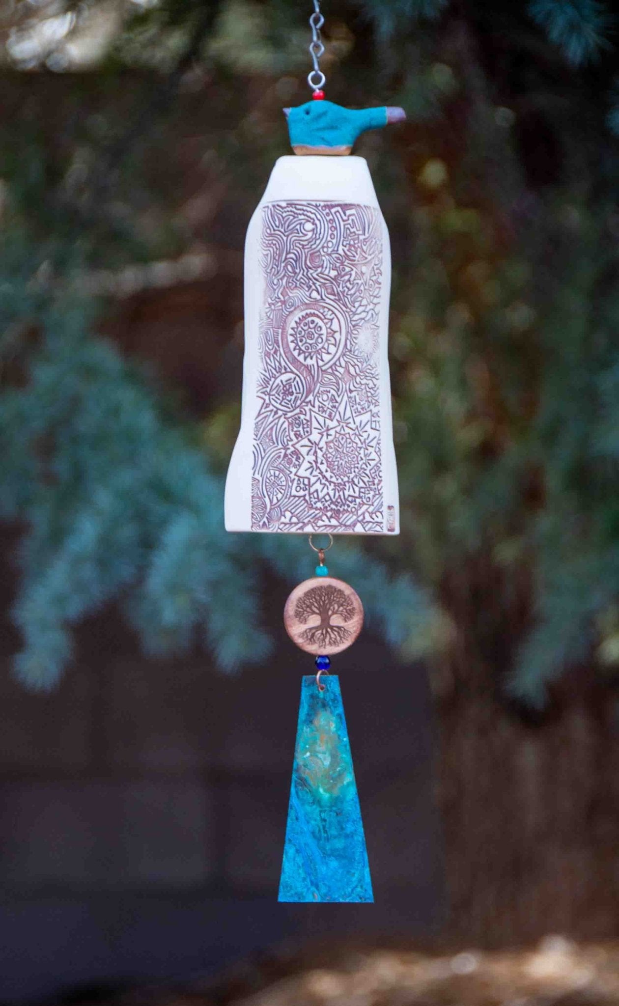 Personalized sympathy wind chime with blue glazed bird topper and copper sail