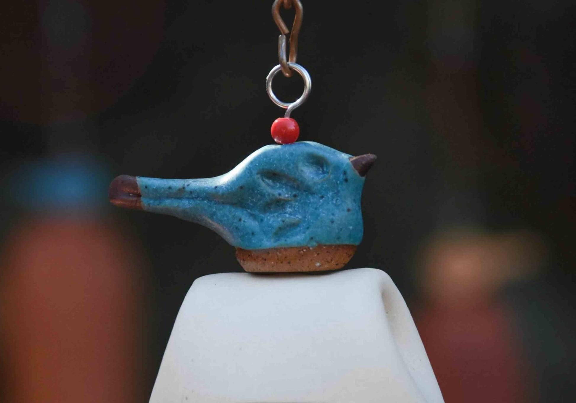 Blue glazed bird topper on handcrafted remembrance wind chime