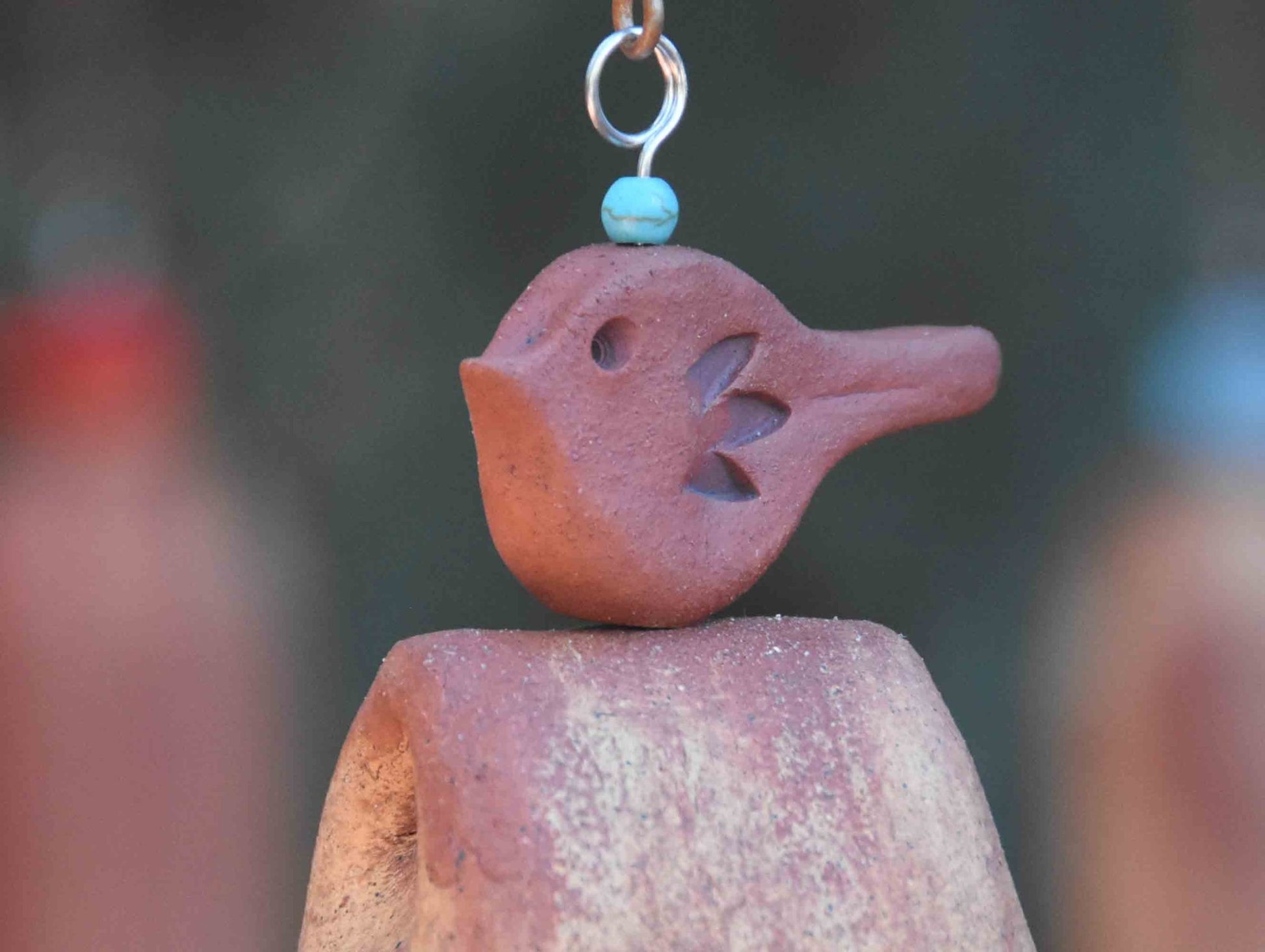 Rustic red bird topper on handmade ceramic memorial wind chime