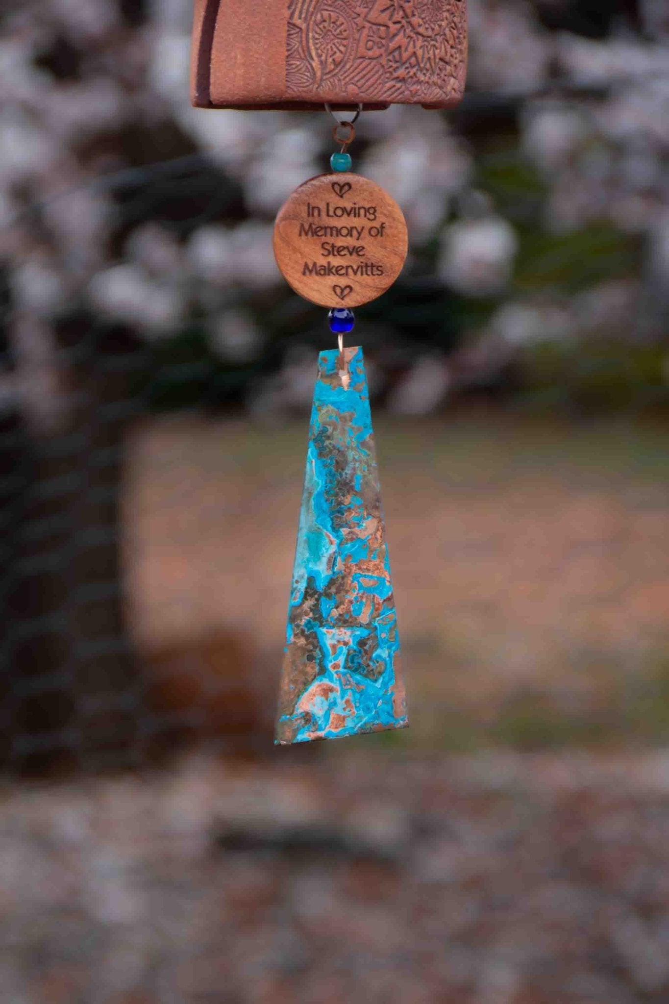 Rustic tan memorial wind chime with copper sail and sympathy engraving