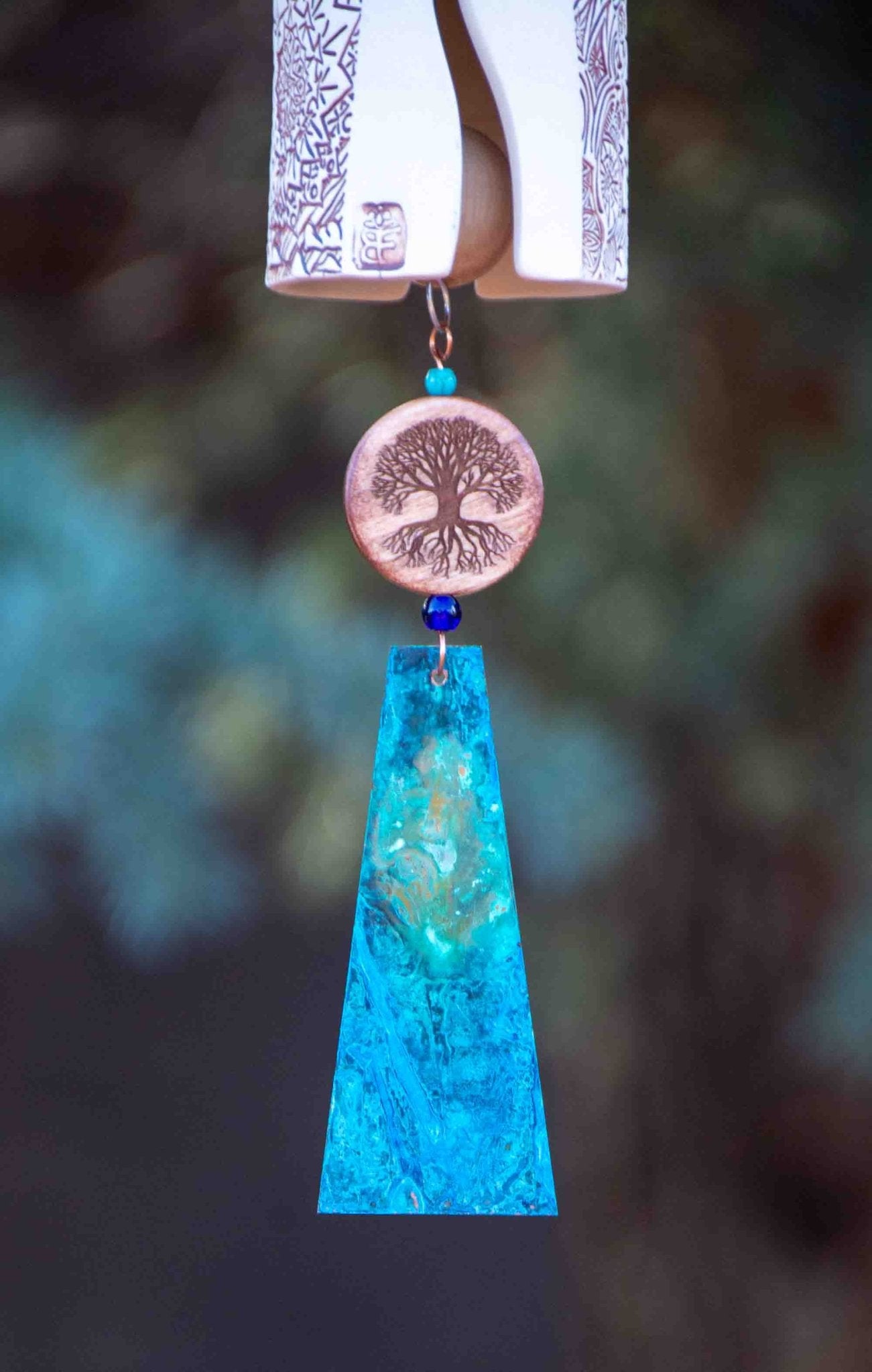Pet memorial wind chime with paw print and tree of life design and copper wind sail