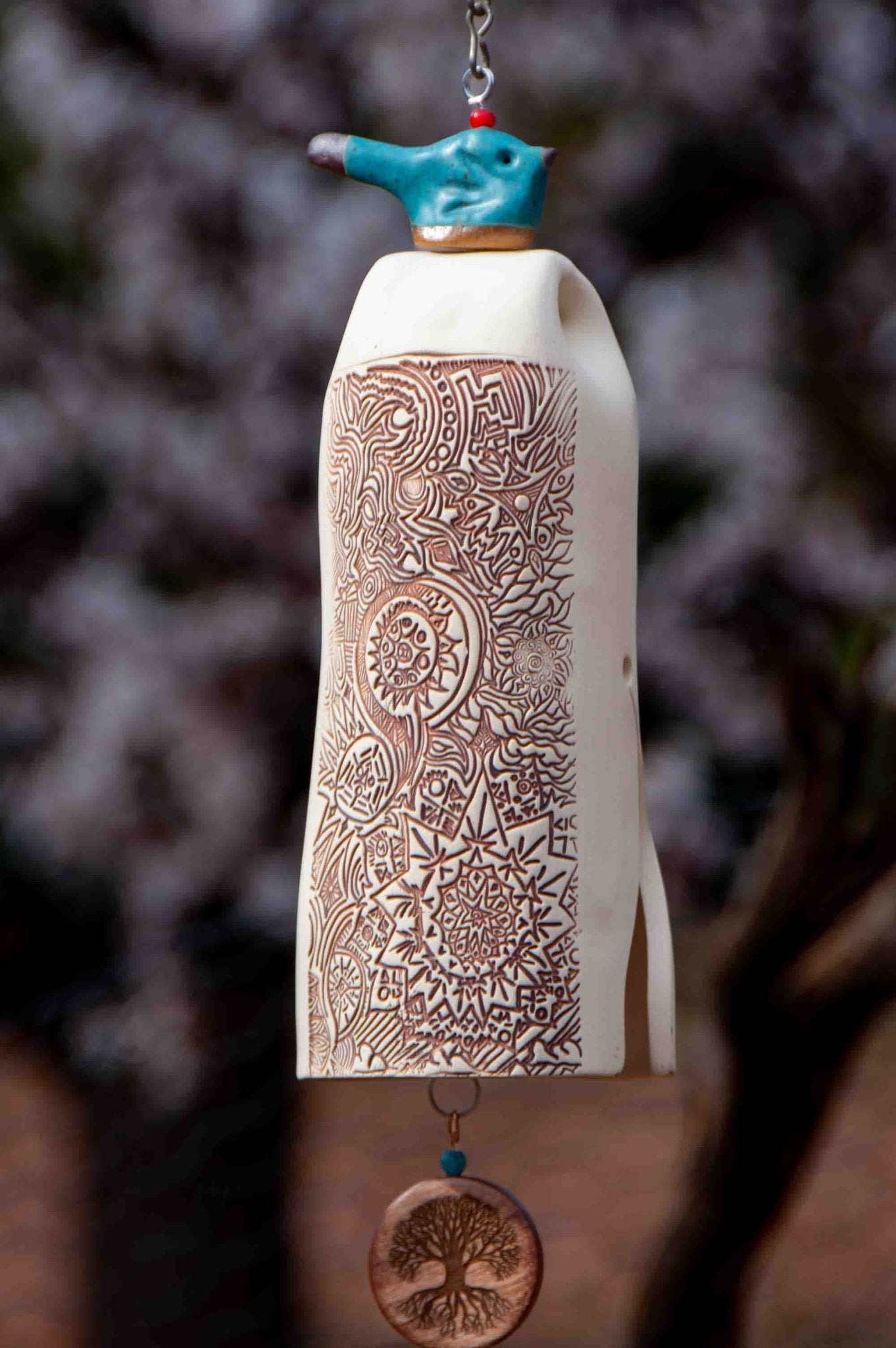 White ceramic wind chime with custom engraved wooden sympathy sail