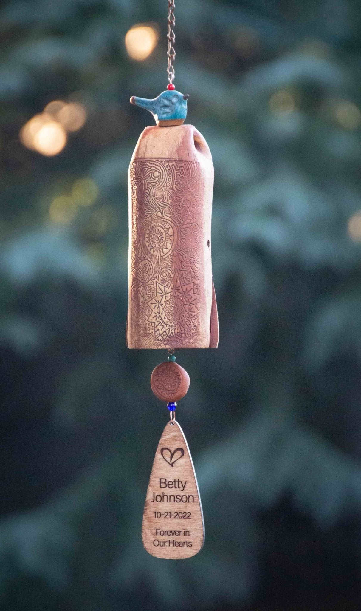 Rustic tan memorial wind chime with custom wooden sail inscription