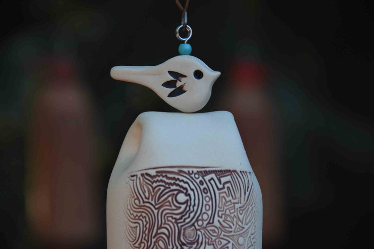 Rustic ceramic wind chimes with earthy tones and copper sails, handmade by EarthWind Bells