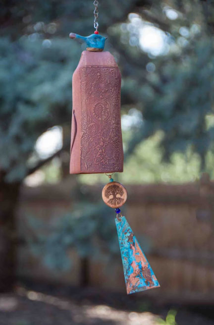 Memorial wind chimes creating a soothing sound in a garden
