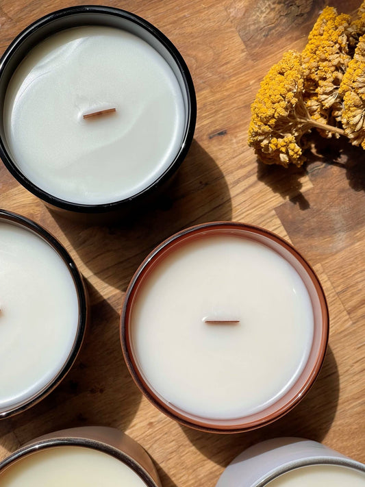 Top view of coconut soy wood wick sympathy candles with dried flowers